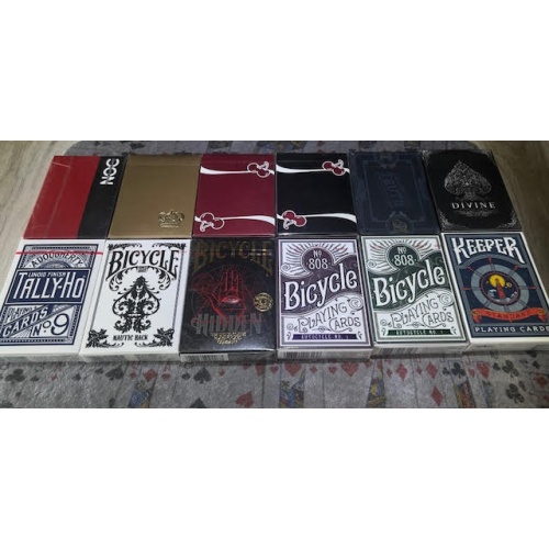 Stack of 12 Unopened mixed playing cards